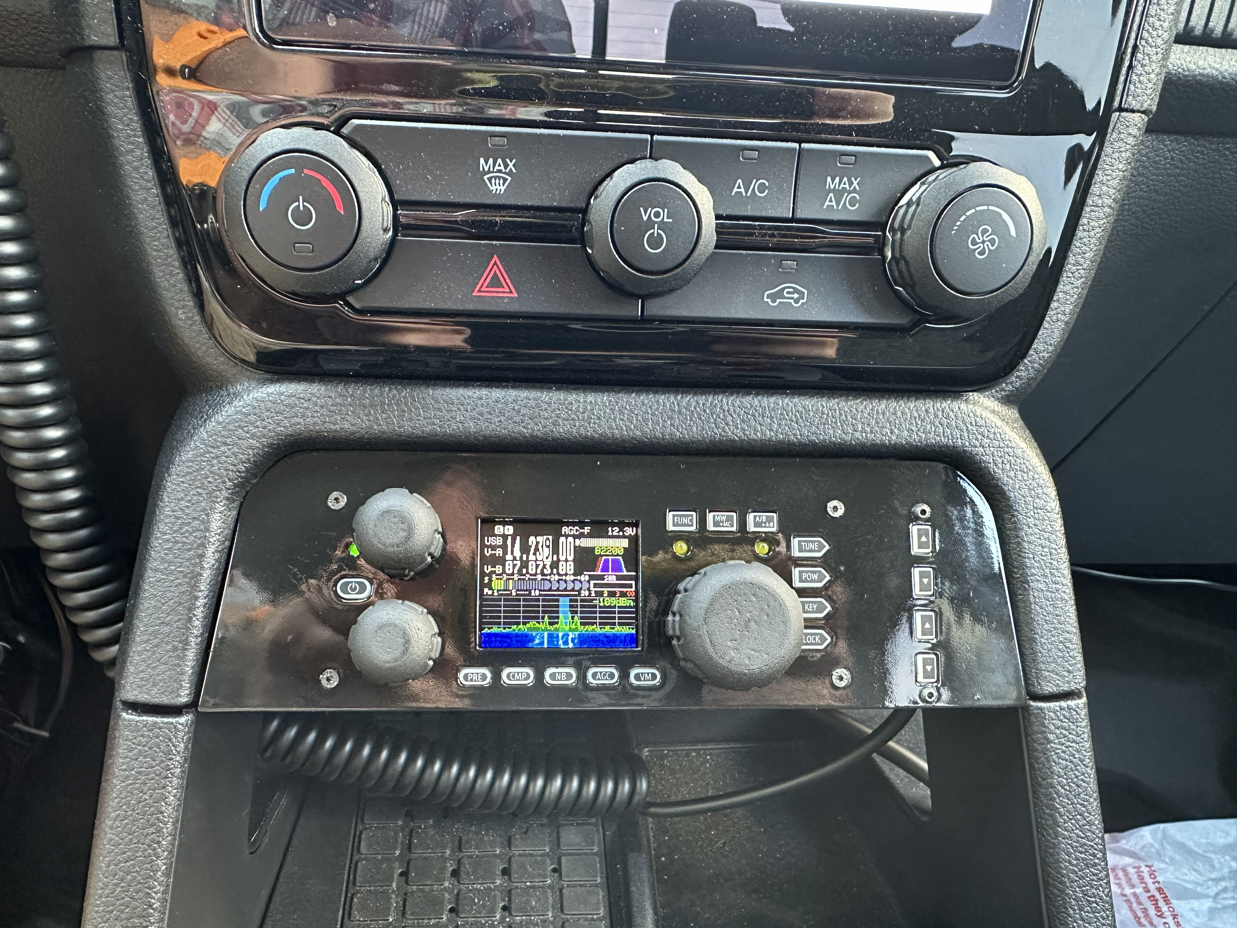 Xiegu G90 head unit mounted in a custom 3D-printed faceplate in the center console of a Ford Ranger. Display shows 14.239.00 MHz USB on V-A, 07.073.00 MHz on V-B, 12.3V supply, waterfall active.